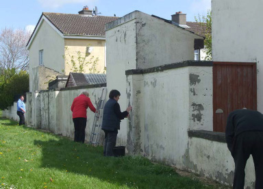 Photo: Adopt a patch scheme, residents painting a wall